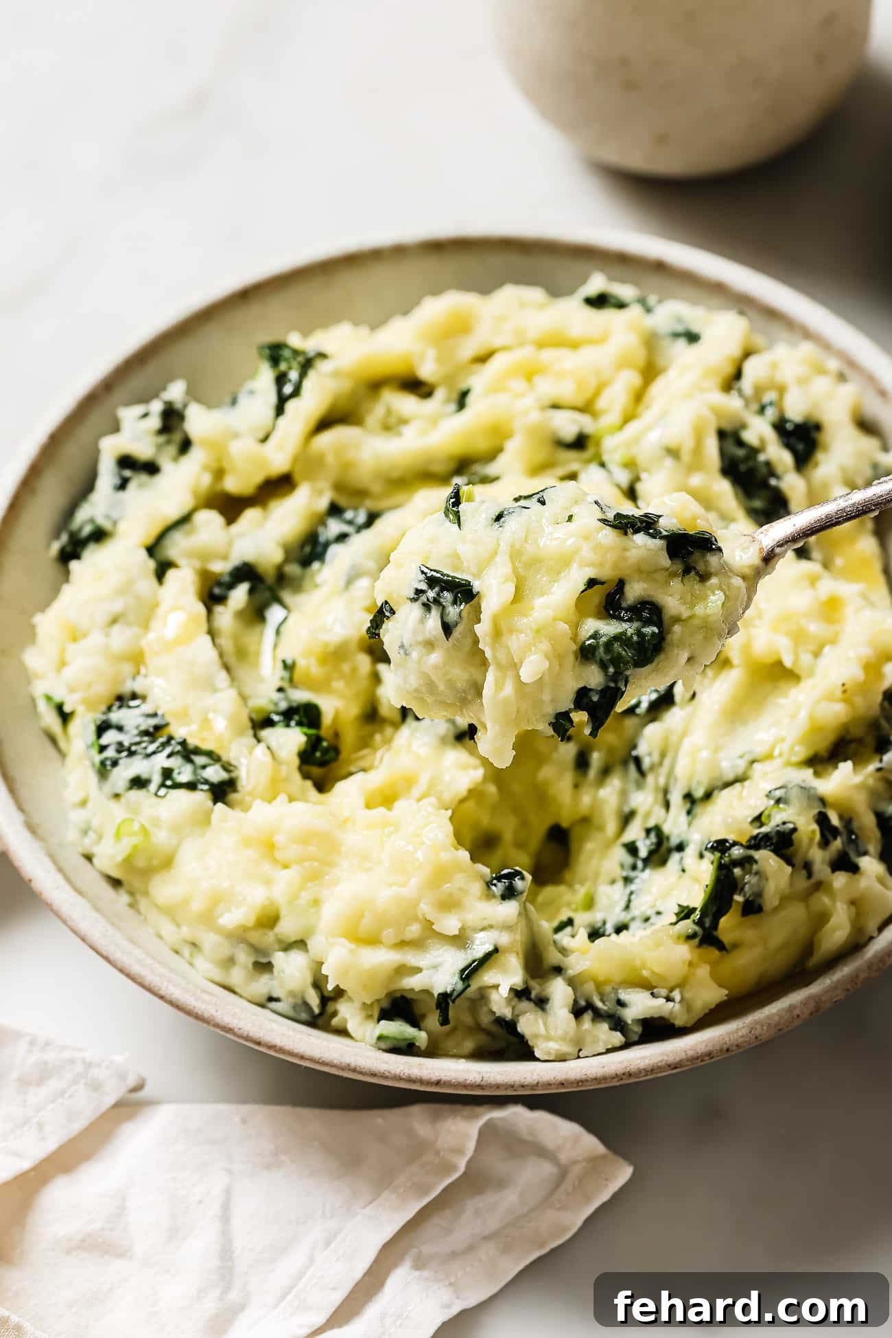 Irish Comfort Colcannon 8 close up of colcannon on a bowl, with melted butter in the center
