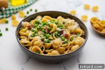 Spring Pea Pasta 7 A final bowl of Pasta with Peas, pancetta, and Parmesan cheese, garnished and ready for serving.