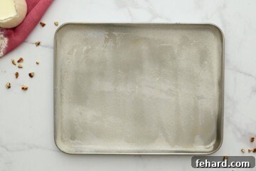 Floured and greased sheet pan, perfectly prepared for the Texas sheet cake batter.
