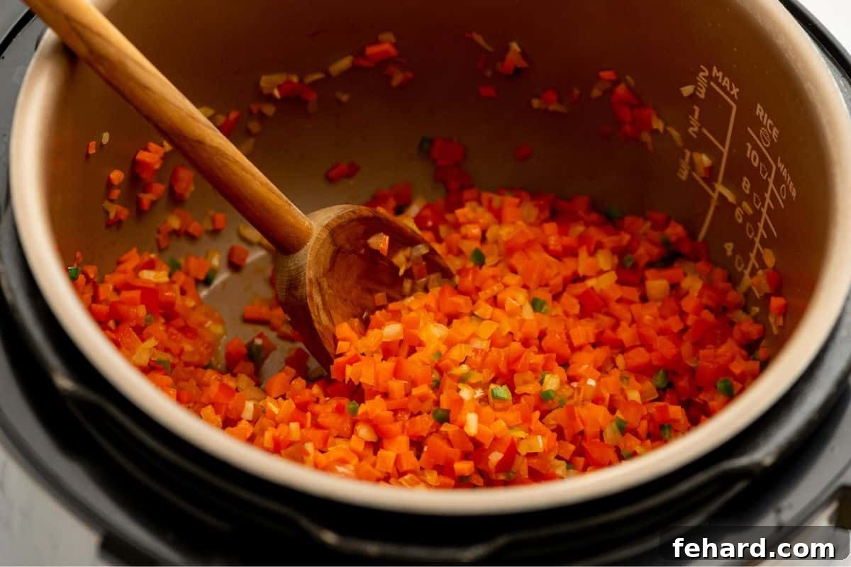 Best Black Bean Soup Recipe Sauteed peppers, carrots, onions, and jalapenos inside inner pot.