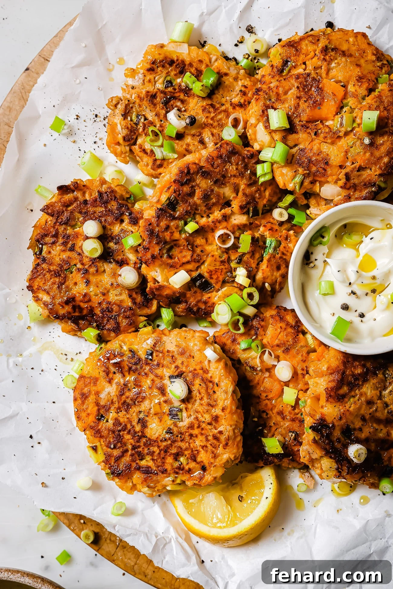 Plated Sweet Potato Tuna Patties garnished with fresh scallions, ready to be enjoyed.