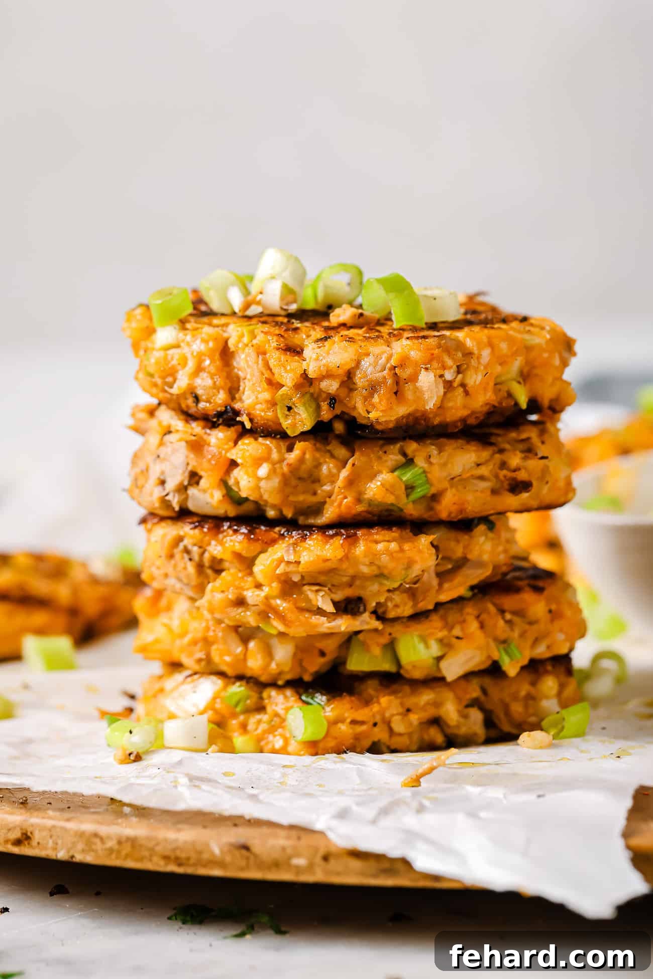 A stack of perfectly cooked sweet potato tuna patties, ready to be served or stored.