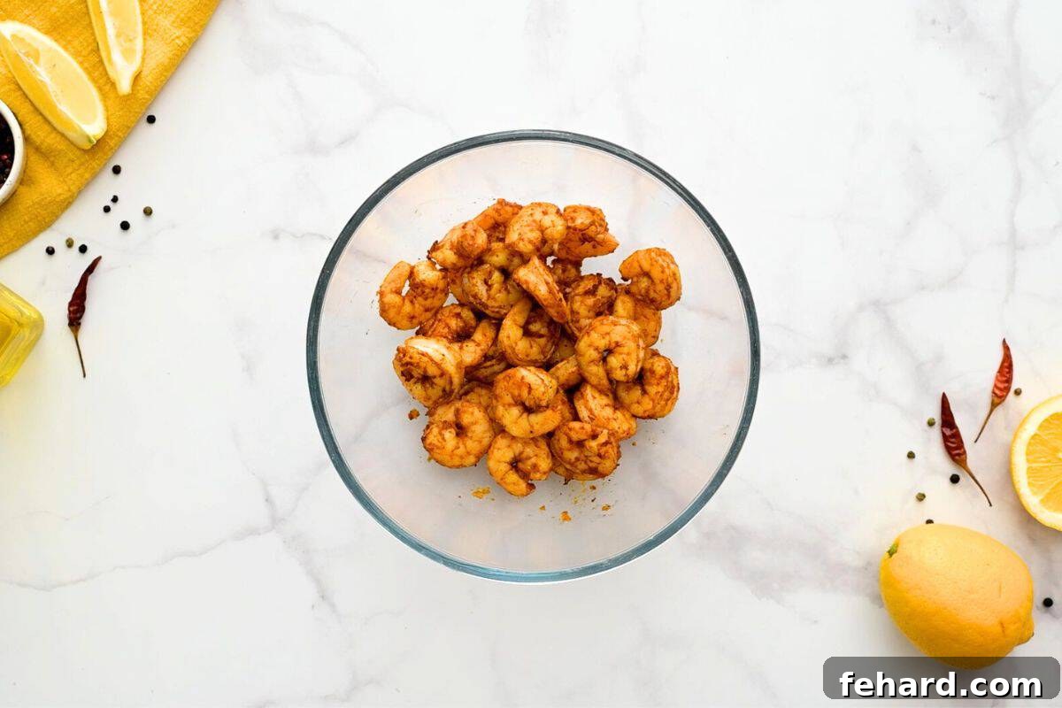 Succulent air-fried shrimp glistening with a freshly applied honey-lemon-garlic glaze, tossed to perfection and ready to be served.