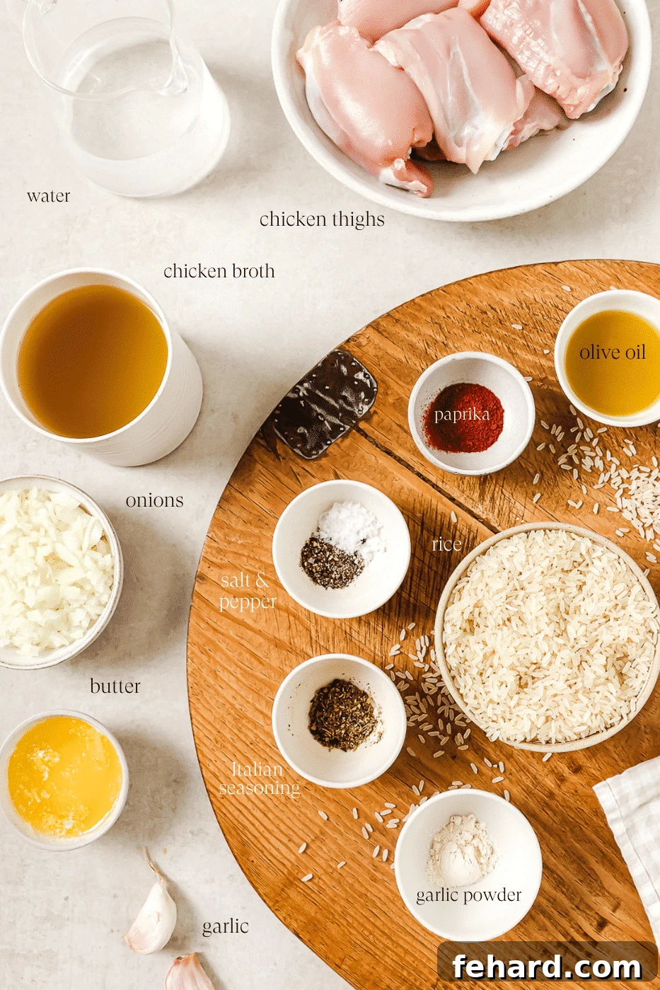 An overhead view of all pre-measured ingredients laid out neatly on a wooden cutting board, ready for cooking.