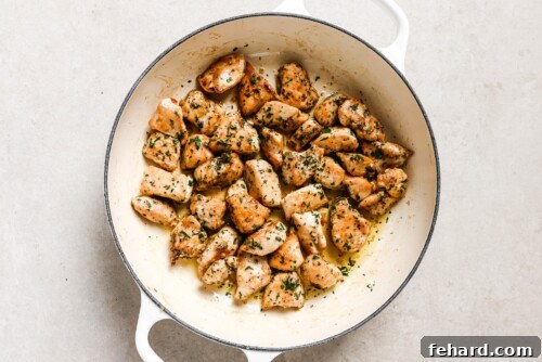 chicken bites in a white skillet