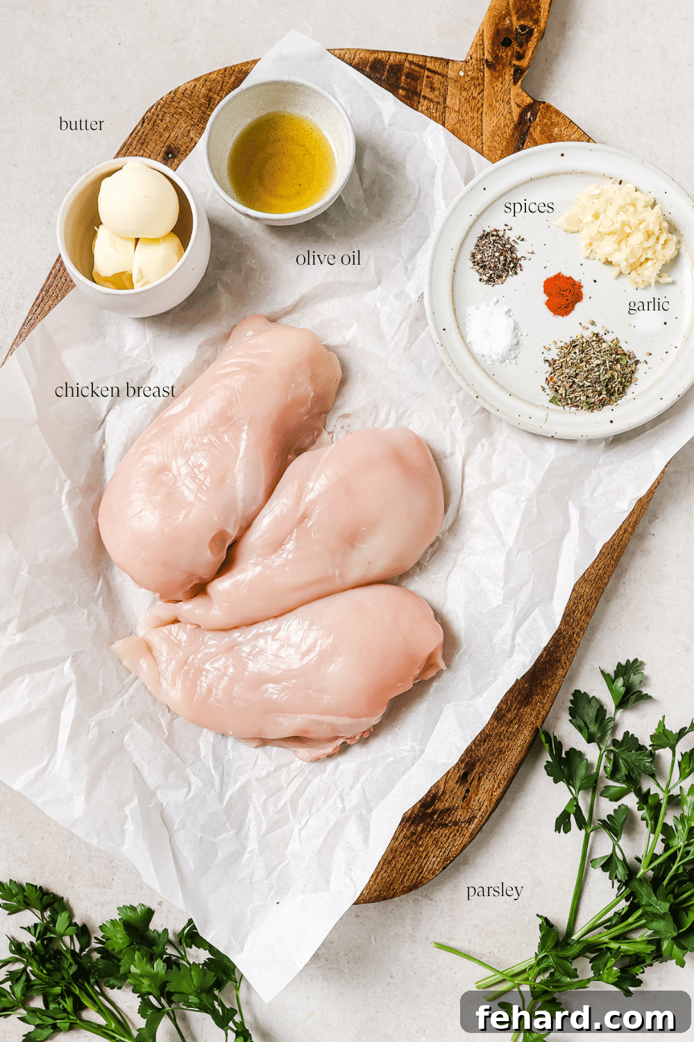 Pre-measured ingredients for garlic butter chicken bites, neatly arranged with text overlays labeling each one for easy identification.