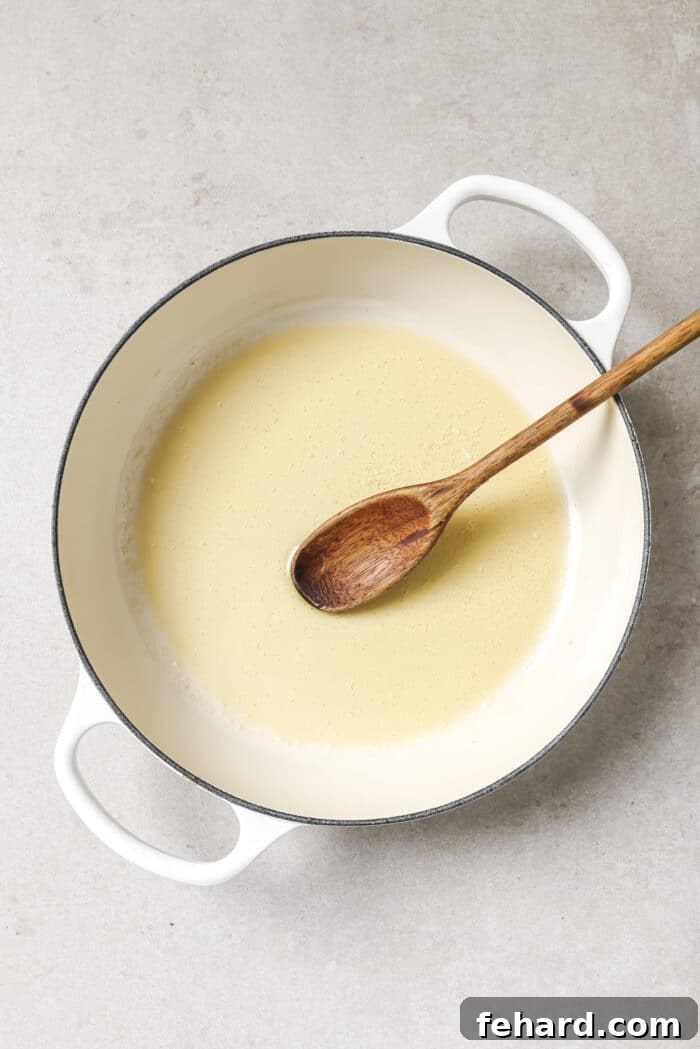 Olive oil and butter melting together in a cast iron skillet
