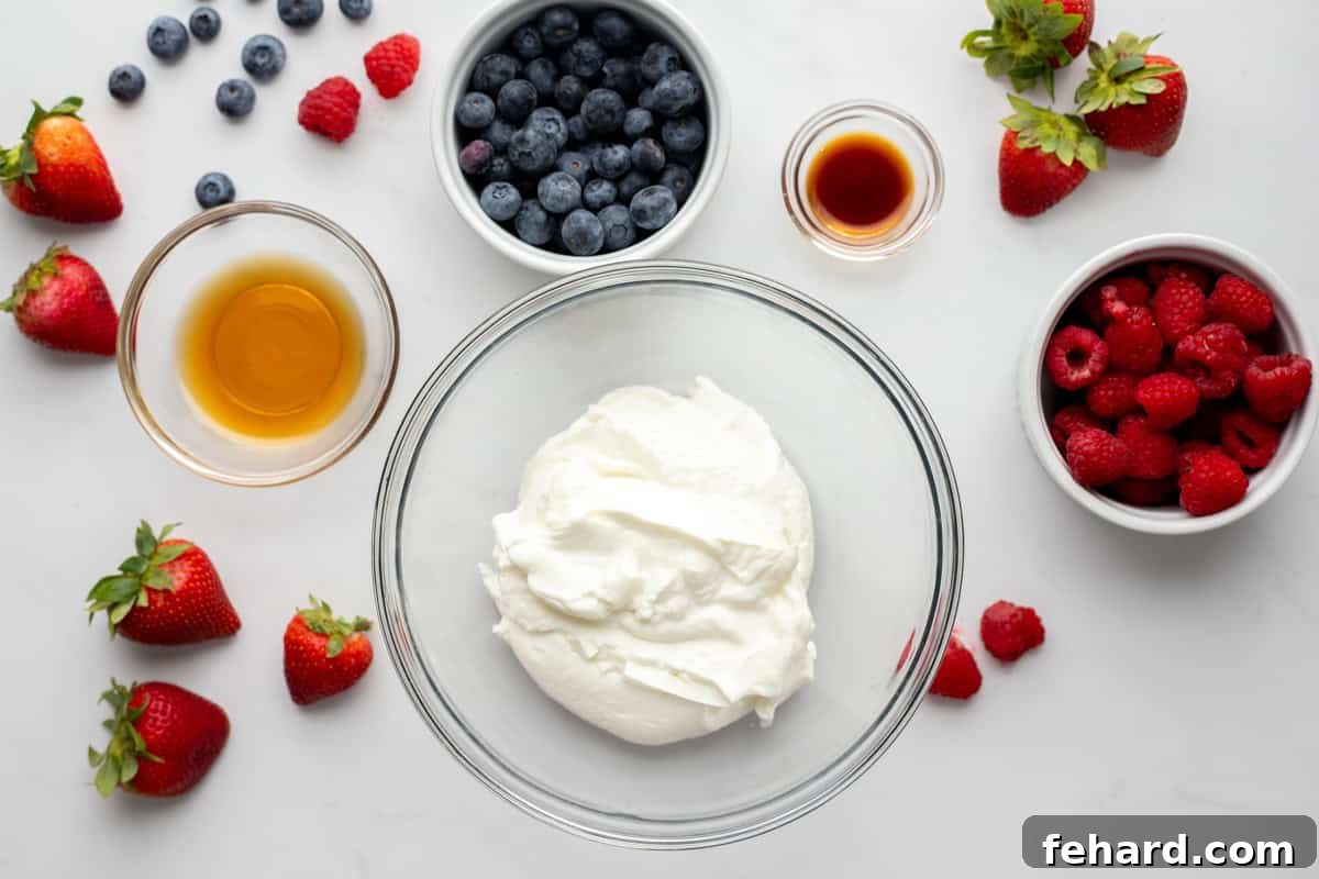 Easy Frozen Yogurt Bark Ingredients Yogurt, maple syrup, vanilla extract, and berries on counter.