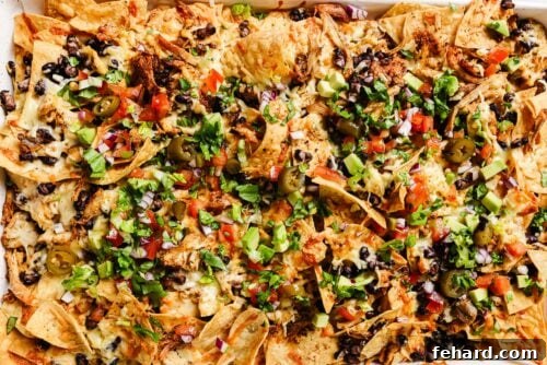 closeup view of Chicken-Nachos on a baking sheet