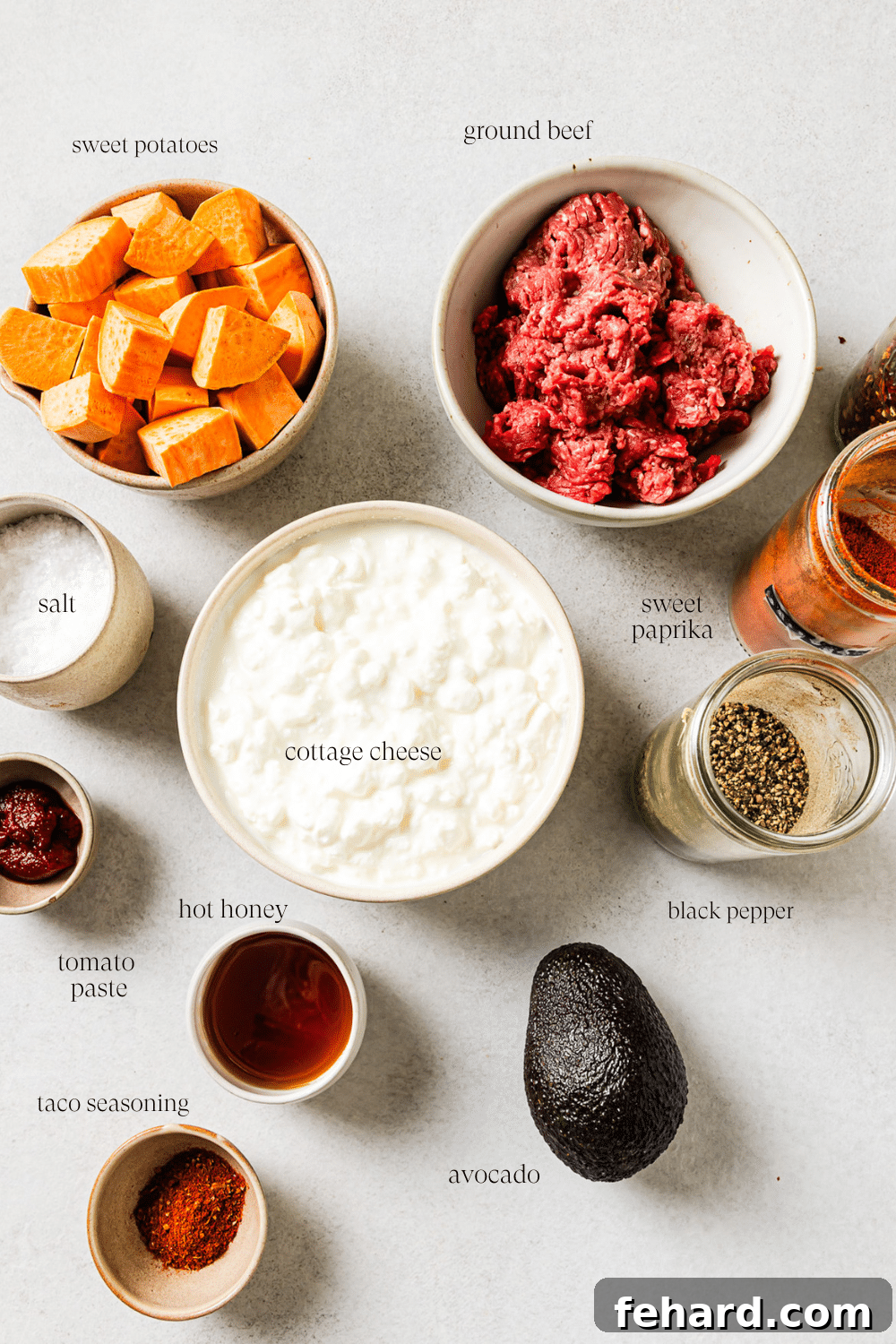 on the ingredients together on a countertop to make cottage cheese taco bowl. 