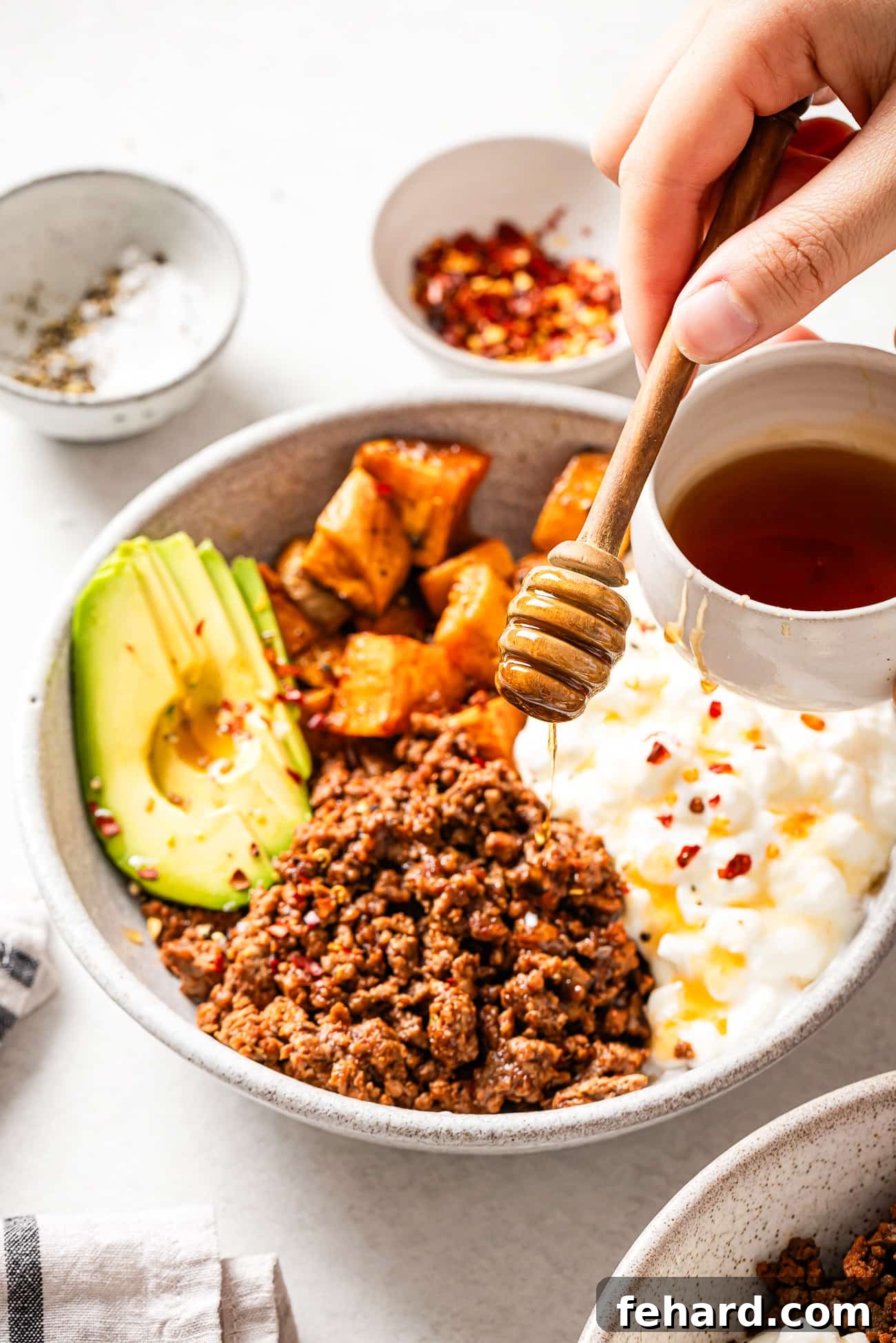 overhead view of Cottage Cheese Taco Bowl with hot honey on top. 