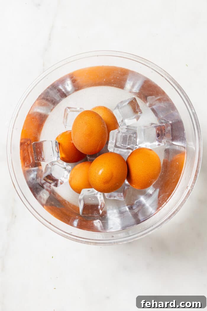 Hard-boiled eggs in a bowl of ice water. 