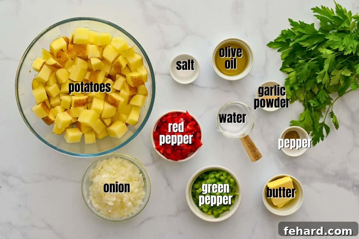 Various ingredients for Potatoes O'Brien, including Yukon Gold potatoes, red and green bell peppers, yellow onion, butter, olive oil, salt, pepper, and garlic powder, neatly laid out on a kitchen counter.