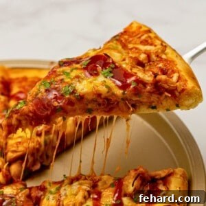 BBQ Pizza topped with BBQ sauce, shredded chicken, and cheese.