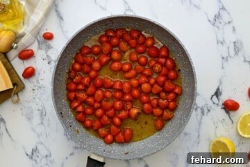 Quick White Bean Pasta with Burst Tomatoes and Fresh Spinach 5 Wine and tomatoes in saute pan.