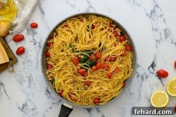 Quick White Bean Pasta with Burst Tomatoes and Fresh Spinach 8 Pasta tossed with tomatoes and white beans.
