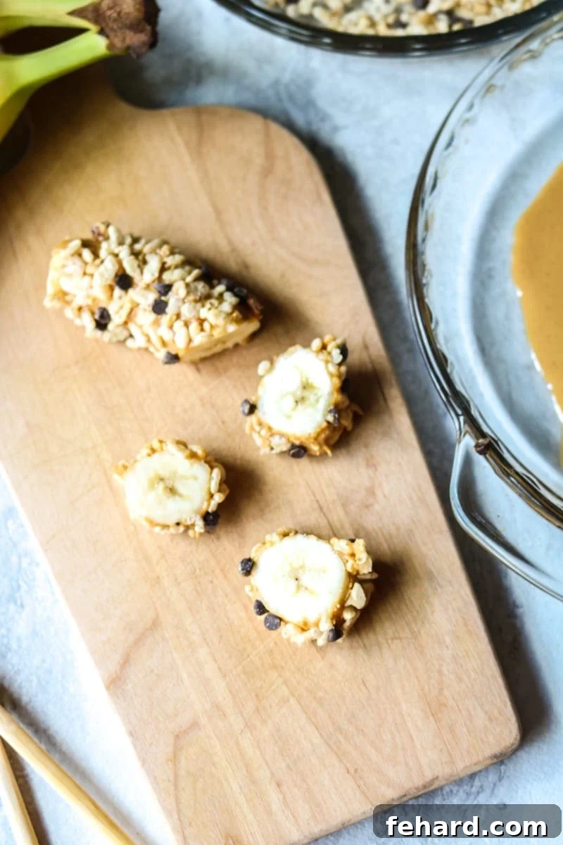 Close-up of Chocolate Peanut Butter Banana Sushi slices, showcasing the creamy peanut butter and crunchy toppings.