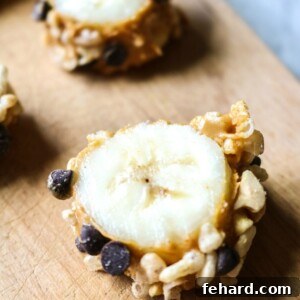 Slice of banana rolled in peanut butter, rice krispies, and chocolate chips