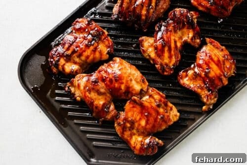 Grilling teriyaki chicken on a grill pan