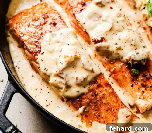 Cooked Marry Me Salmon simmering in its creamy sauce.