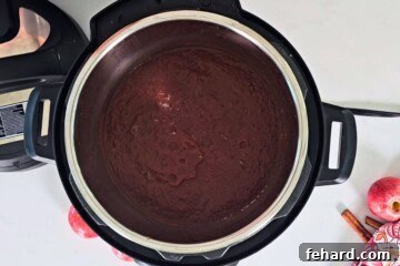 Pressure Cooked Apple butter after being thickened inside inner pot.