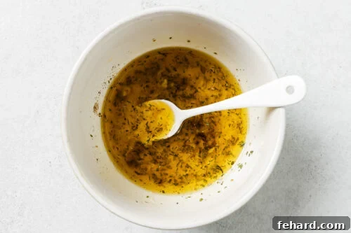 lemon butter sauce in a white bowl