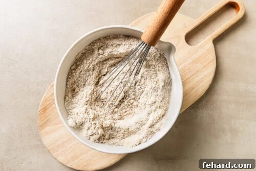 Dry baking ingredients inside a mixing bowl, ready to be combined.