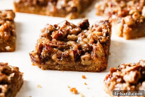 Irresistible Gluten-Free Pecan Bars 16 Close up of pecan pie bars on a countertop
