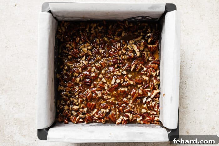 Irresistible Gluten-Free Pecan Bars 8 Overhead view of freshly baked pecan pie bars cooling in a baking pan.