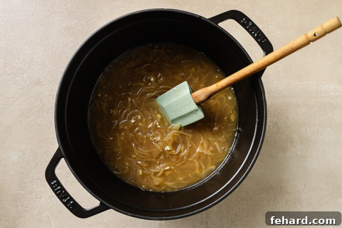 sauteed onions and apple cider in a Dutch oven pot. 