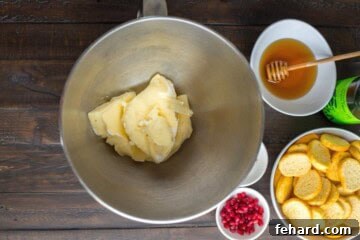 Velvet Brie Whip 2 Brie Cheese with rind removed in stand mixer bowl.