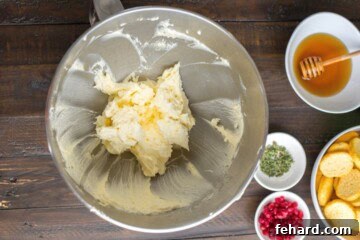 Velvet Brie Whip 3 Whipped brie inside stand mixer mixing bowl after being whipped until creamy and fluffy.