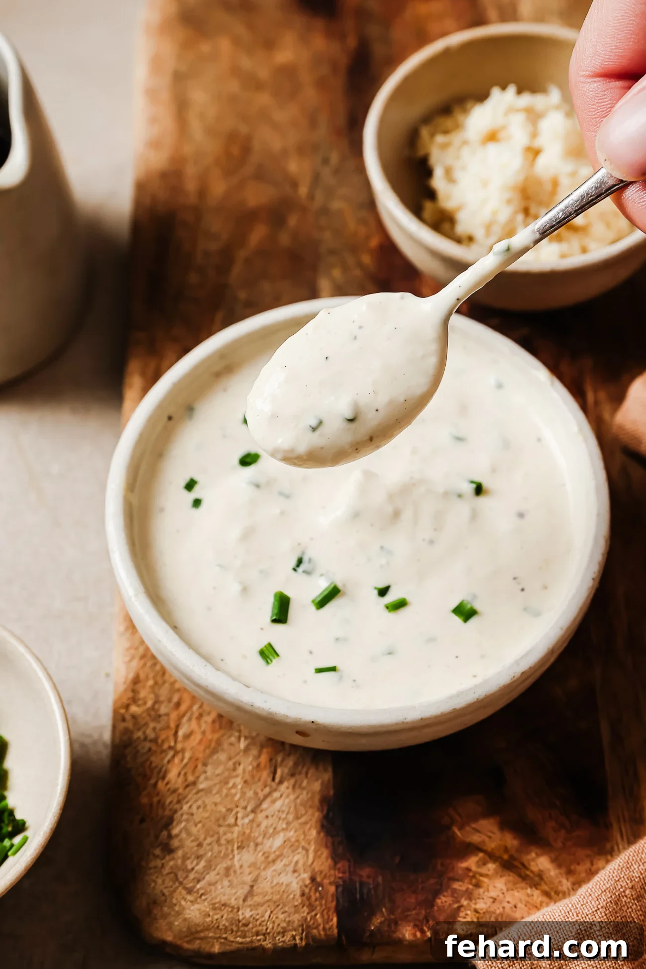 closeup view of horseradish sauce in a white bowl.