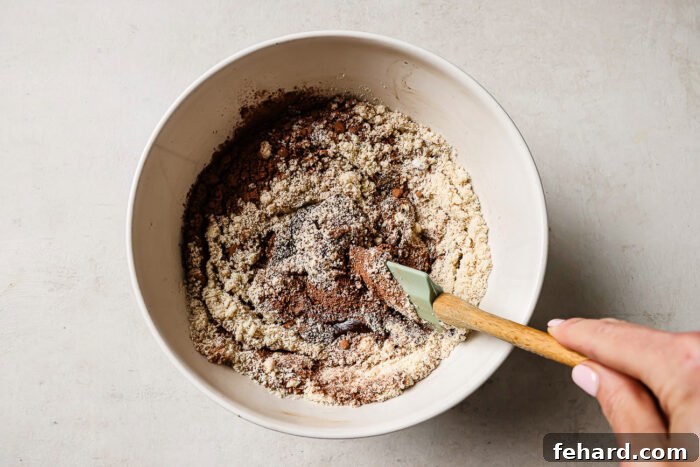 Pecan Pie Swirl Brownies 5 Rich pecan pie brownie batter in a white mixing bowl.