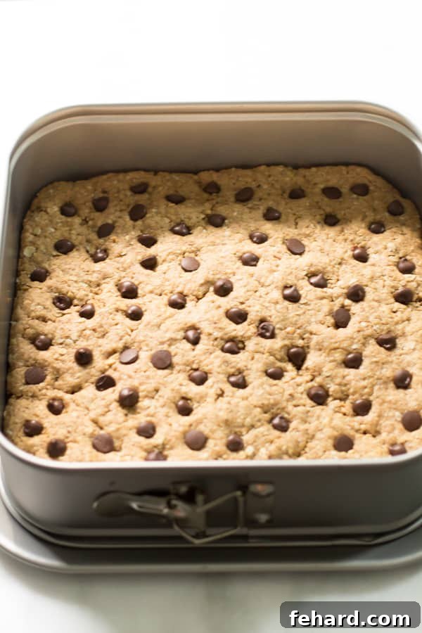 Peanut Butter Chocolate Chip Bars Peanut Butter Chocolate Chip Bars in a baking pan, ready to be cut