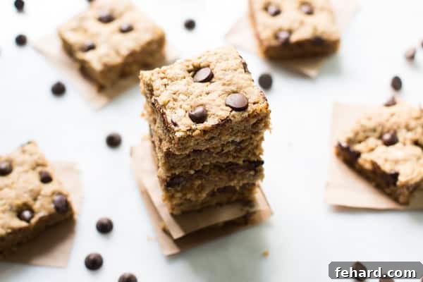 Peanut Butter Chocolate Chip Bars Stacked Peanut Butter Chocolate Chip Bars on a cooling rack