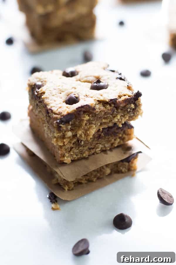 Peanut Butter Chocolate Chip Bars Close up of three Peanut Butter Chocolate Chip Bars with melted chocolate