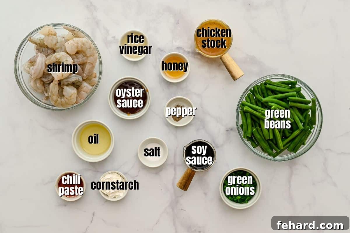 Carefully measured and labeled ingredients for a homemade Hunan Shrimp stir-fry, including fresh green beans, chili paste, soy sauce, and shrimp, all ready for cooking.
