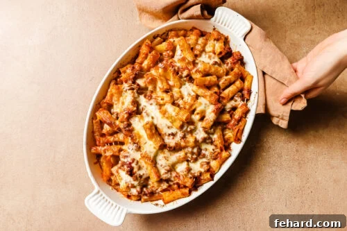 Just out of the oven: baked rigatoni with ground beef in a casserole dish.