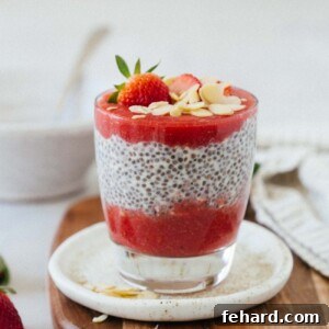 Luscious Strawberry Chia Delight 9 Strawberry chia seed pudding with strawberries and almonds on top.