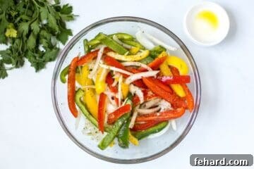Green, yellow, red peppers with onions seasoned with olive oil, Italian seasoning, garlic, salt and pepper.