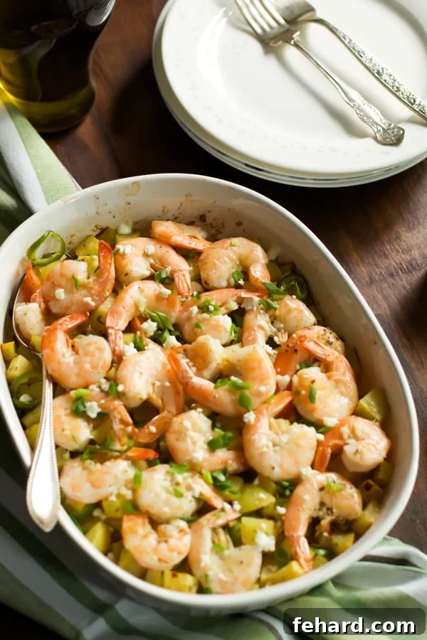 baked Potato with lemon shrimp in a serving dish