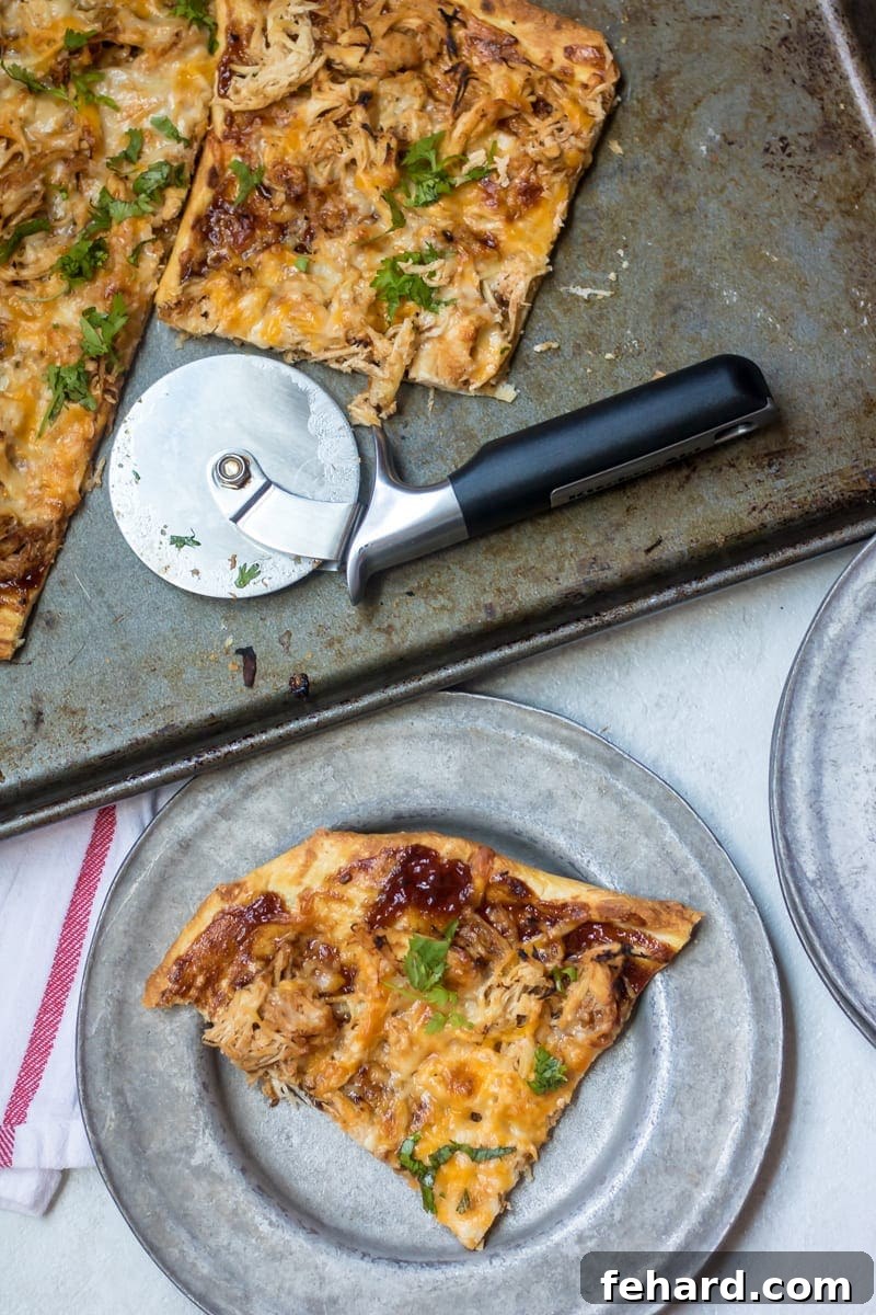 Delicious Pulled Pork Pizza, freshly pulled off the grill, showcasing a perfectly browned crust and melted cheese.