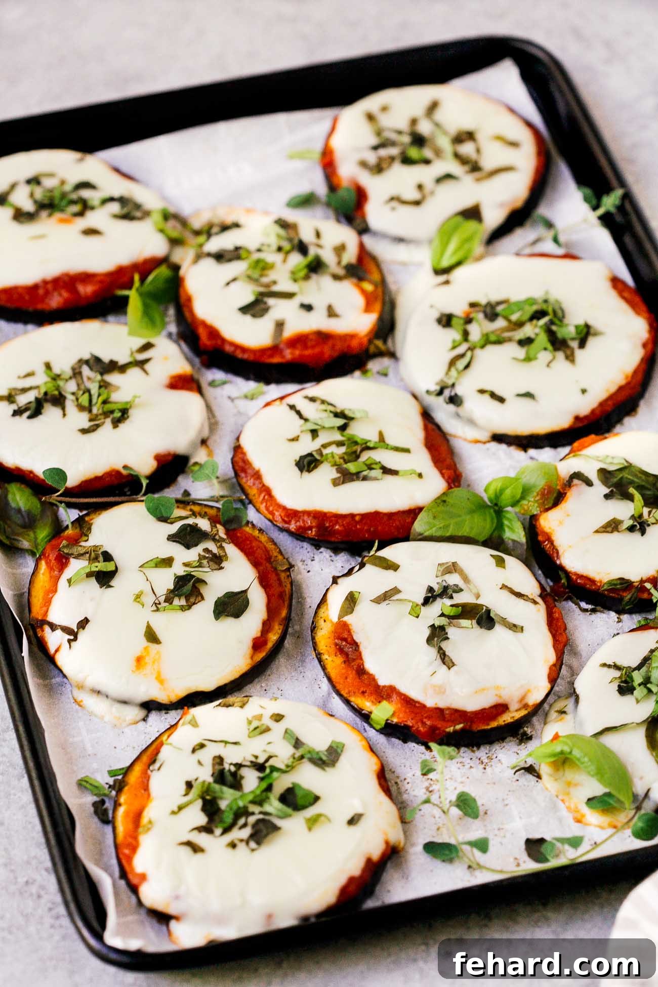 Mini Eggplant Pizzas 6 closeup of eggplant pizza on a baking sheet