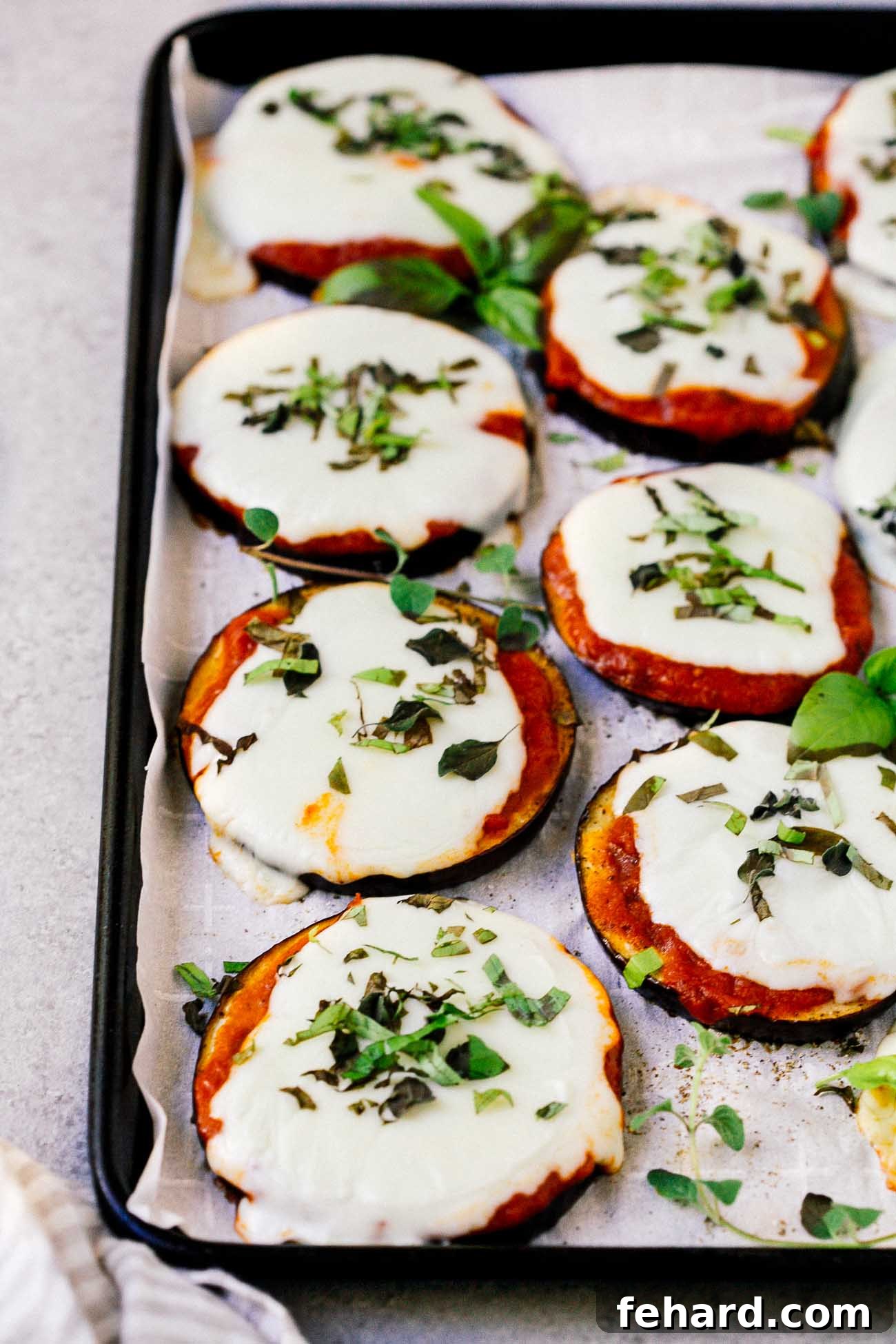 Mini Eggplant Pizzas 7 closeup of eggplant pizza on a baking sheet