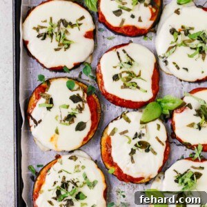 overhead view of eggplant pizza on a baking sheet