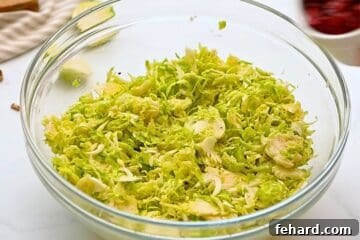 Shaved brussels sprouts tossed with honey lemon dressing.