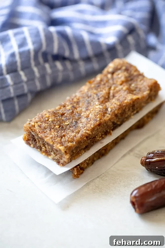 Homemade Lararbars on Parchment Paper - A healthy, easy copycat recipe for energy bars made with nuts and dates.