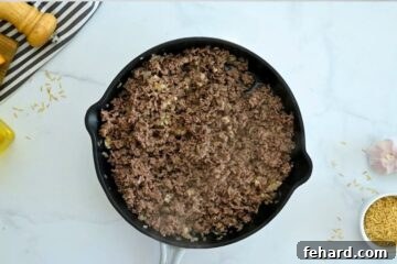 Fiesta Taco Rice Bake 3 Ground beef, onion, and garlic sauteed together in large deep skillet.