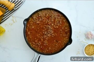 Fiesta Taco Rice Bake 4 Deep skillet with taco meat, salsa, beef broth.